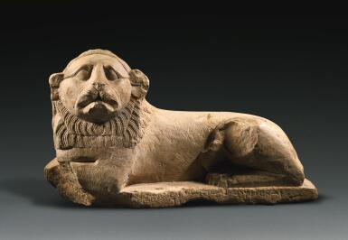 View full screen - View 1 of Lot 58. AN EGYPTIAN INDURATED LIMESTONE FIGURE OF A LION, PTOLEMAIC PERIOD, LAST QUARTER OF THE 3RD CENTURY B.C..