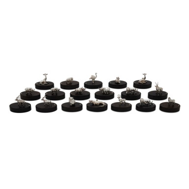 View full screen - View 1 of Lot 97. A set of eighteen Zimbabwean silver and wood animal place card holders, Patrick Mavros, Harare, modern.