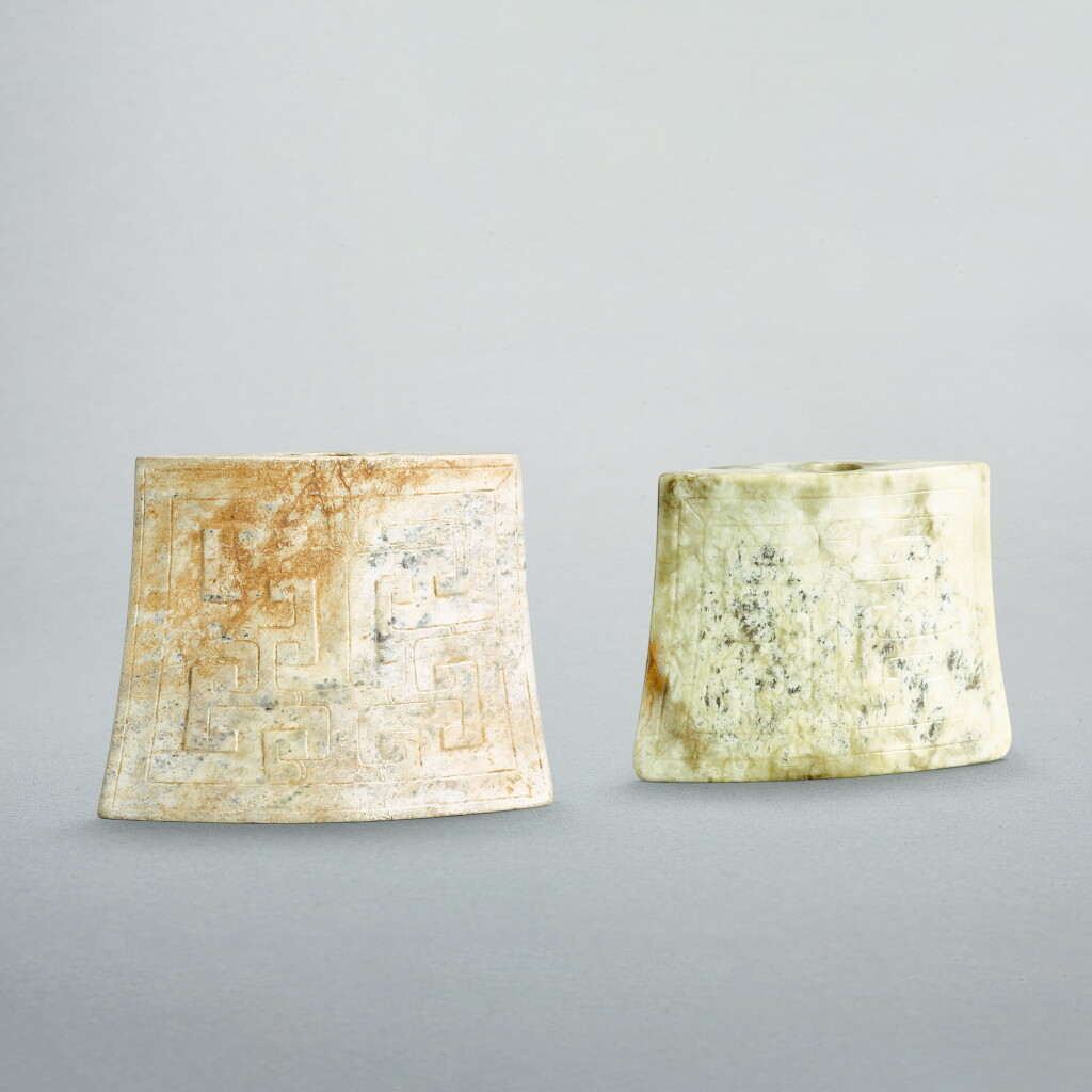 View full screen - View 1 of Lot 747. Two jade 'mask' scabbard chapes, Late Warring States period - early Western Han dynasty | 戰國晚期至西漢早期 變體獸面紋玉劍珌兩件.