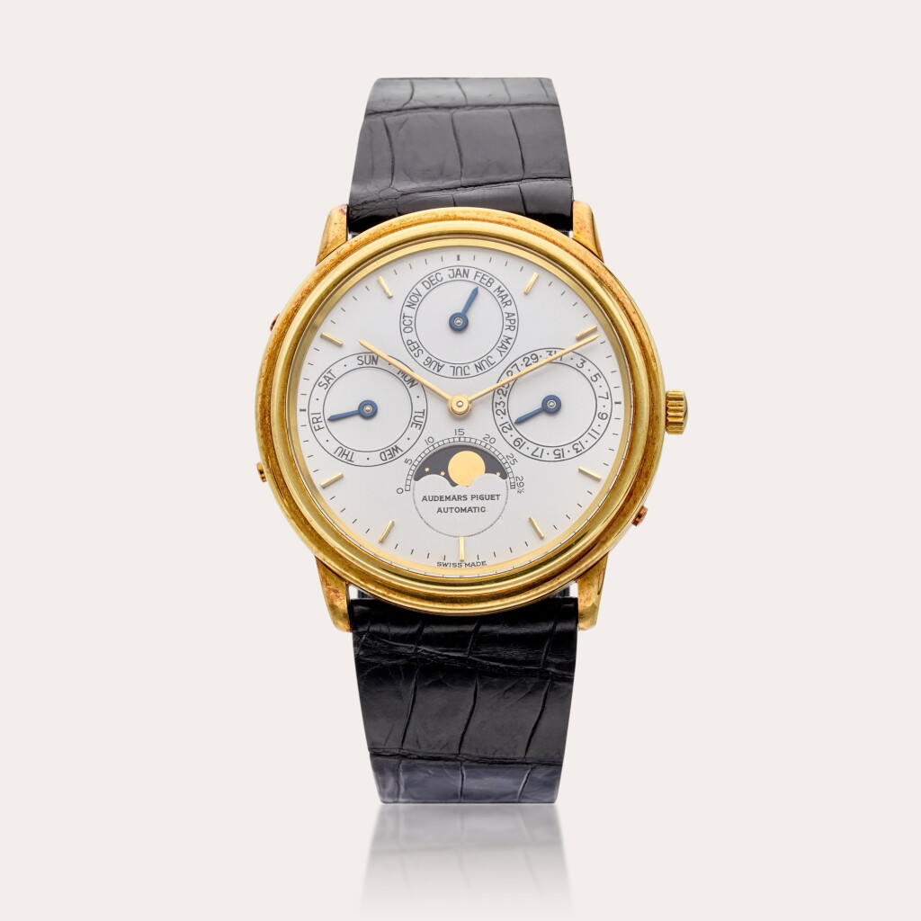 View full screen - View 1 of Lot 483. A yellow gold automatic perpetual calendar wristwatch with moon phases, Circa 1980s.