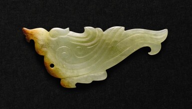 View full screen - View 1 of Lot 228. A SMALL CELADON AND RUSSET JADE 'BIRD' PENDANT WESTERN ZHOU DYNASTY | 西周 青玉鳥形珮.