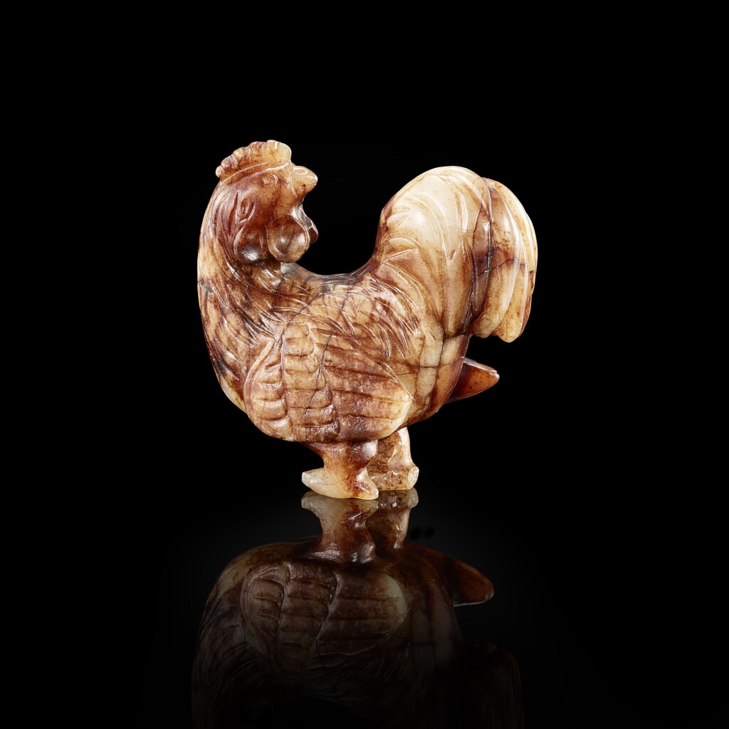View full screen - View 1 of Lot 3023. A white and russet jade rooster, Ming dynasty 明 白玉帶皮寶雞.