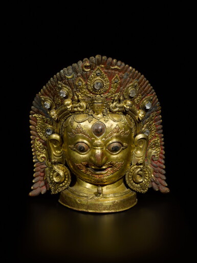 View full screen - View 1 of Lot 63. An exceptional large gilt-copper mask of Bhairava with inset jewellery and painted details Nepal, 16th century, dated Nepal Samvat 719, equivalent to 1598 CE | 尼泊爾 鎏金銅嵌寶加彩陪臚面具 刻文:尼瓦歷719年,相當於西元1598 年.