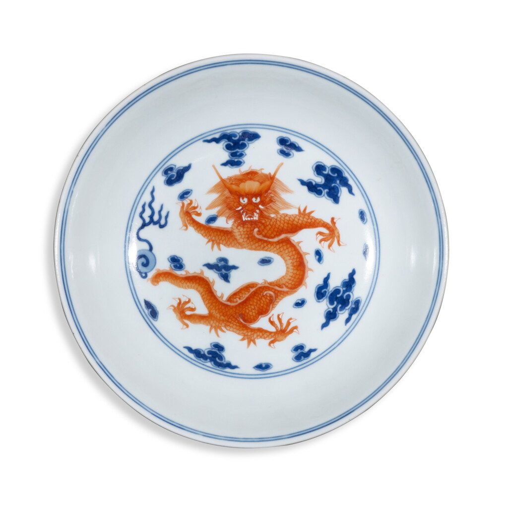 View full screen - View 1 of Lot 1. A blue and white and iron-red-decorated 'dragon' dish, Seal mark and period of Jiaqing.