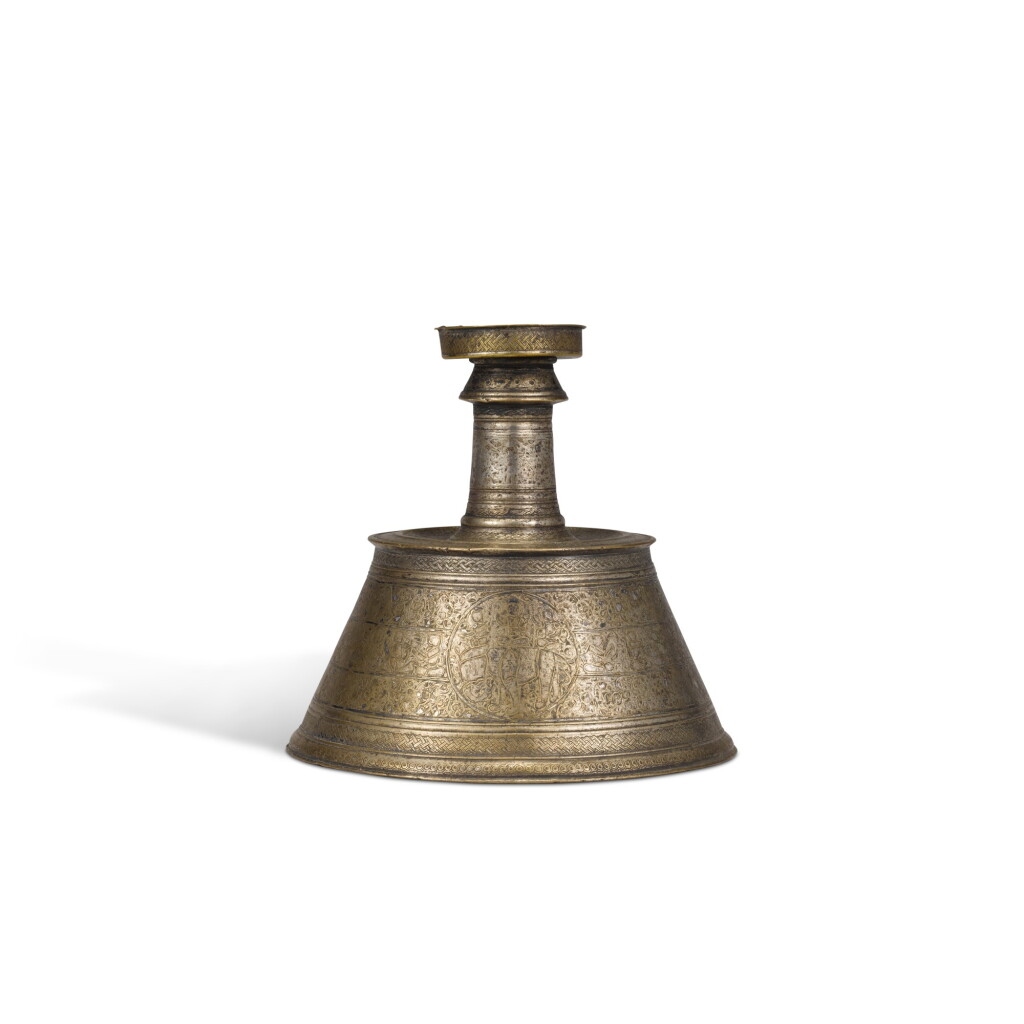 View full screen - View 1 of Lot 99. A Mamluk silver-inlaid brass candlestick, Egypt, circa 1275.