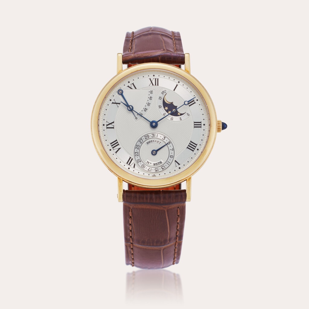 View full screen - View 1 of Lot 209. Reference 3130 Classique | A yellow gold automatic wristwatch with date, moon phases, and power reserve indication, Circa 1995.