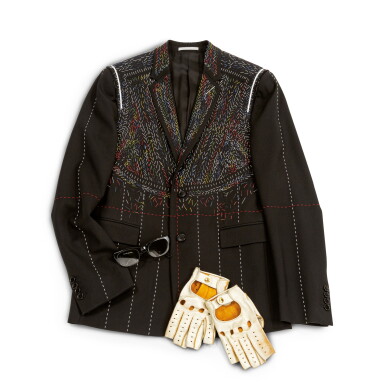View full screen - View 1 of Lot 317. Black and Multicolor Wool Jacket, circa 2000 | Dior Homme, schwarze und mehrfarbige Wolljacke, Größe 48, mit einem Paar goldener Lammfellhandschuhe von Causse und einer E.B. Meyrowitz Sonnenbrille.