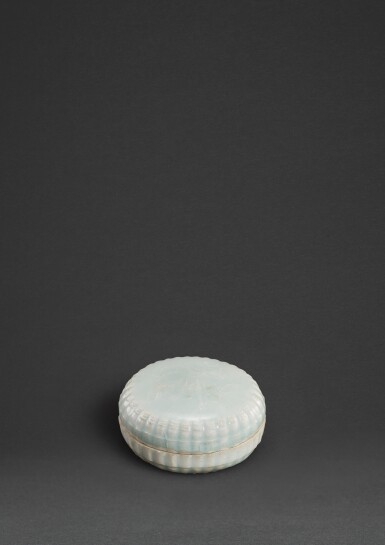 View full screen - View 1 of Lot 48. A small qingbai 'floral' lobed box and cover, Song dynasty | 宋 青白釉堆花卉紋竹節花式小蓋盒.