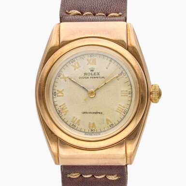 View full screen - View 1 of Lot 503. Reference 3065 Oyster Perpetual 'Hooded Bubbleback' | A yellow gold automatic wristwatch, Circa 1945.