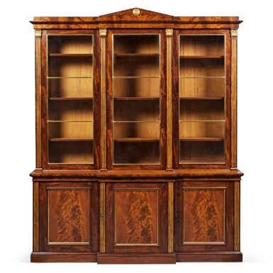 View full screen - View 1 of Lot 444. A George IV Mahogany and Parcel-Gilt Breakfront Library Bookcase, Circa 1825.