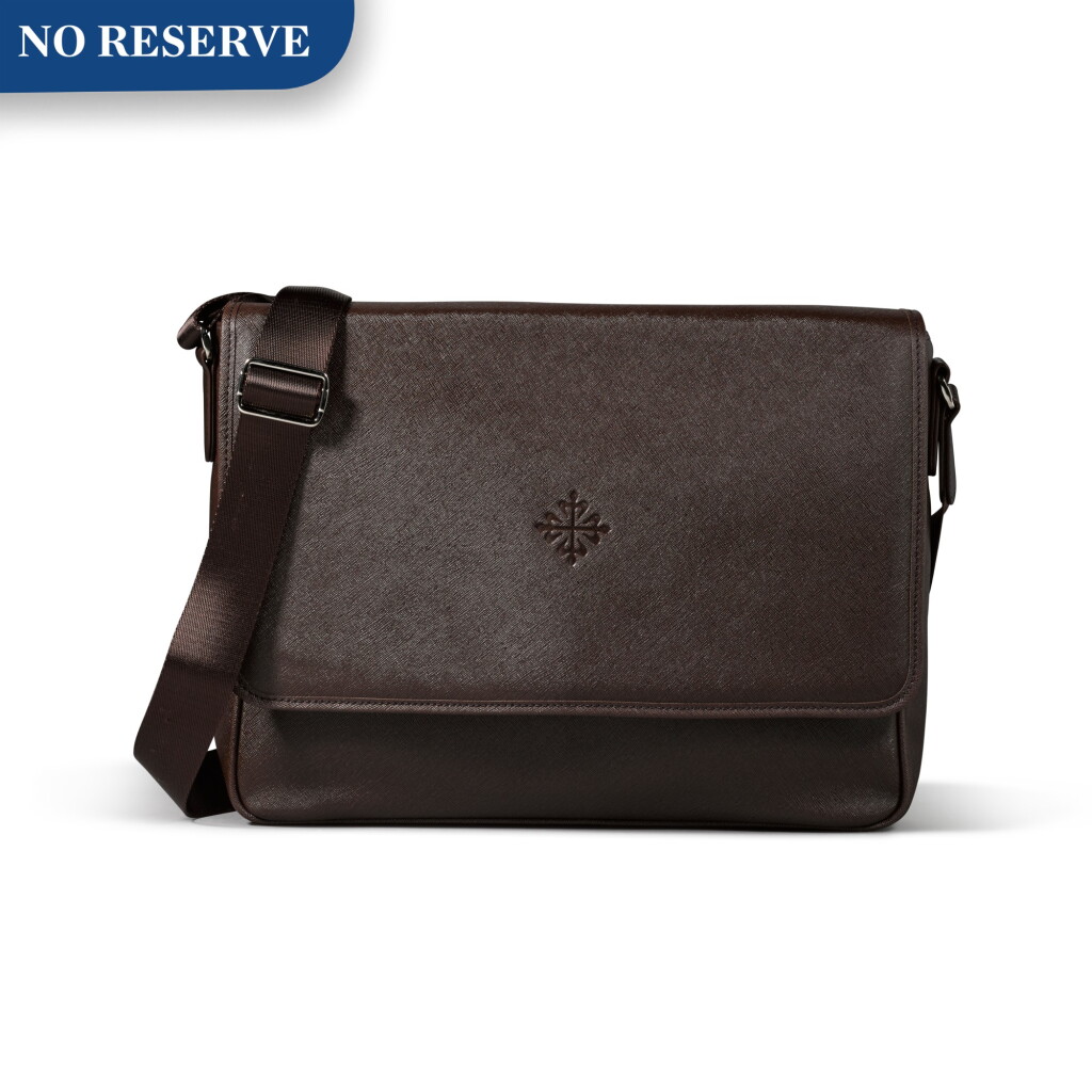 View full screen - View 1 of Lot 722. BROWN FAUX LEATHER MESSENGER BAG.