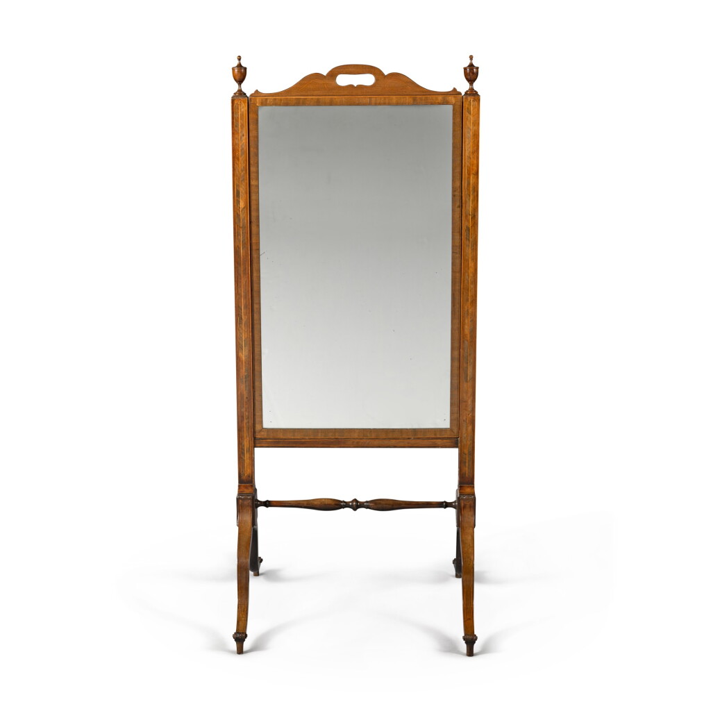 View full screen - View 1 of Lot 135. A George III mahogany and boxwood strung cheval mirror, late 18th century.