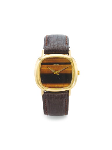 View full screen - View 1 of Lot 168. PIAGET | A YELLOW GOLD WRISTWATCH WITH TIGER'S EYE DIAL CIRCA 1975.
