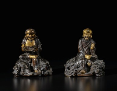 View full screen - View 1 of Lot 663. A rare pair of dated and inscribed parcel-gilt bronze figures of luohan, Qing dynasty, dated Kangxi jiawu year, corresponding to 1714 | 清康熙五十三年(1714) 銅局部鎏金騎象羅漢及笑獅羅漢.