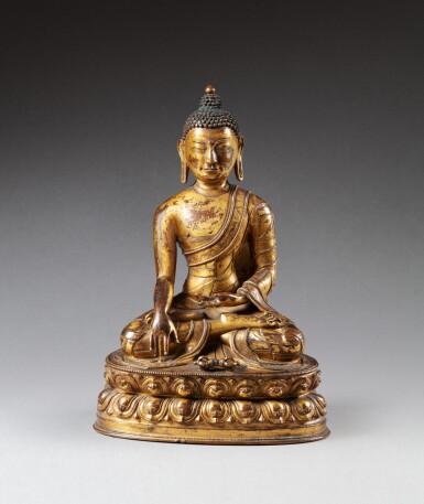 View full screen - View 1 of Lot 42. A gilt-copper alloy figure of a Buddha Tibet, 15th-16th century | 西藏 十五至十六世紀 鎏金銅合金佛坐像.