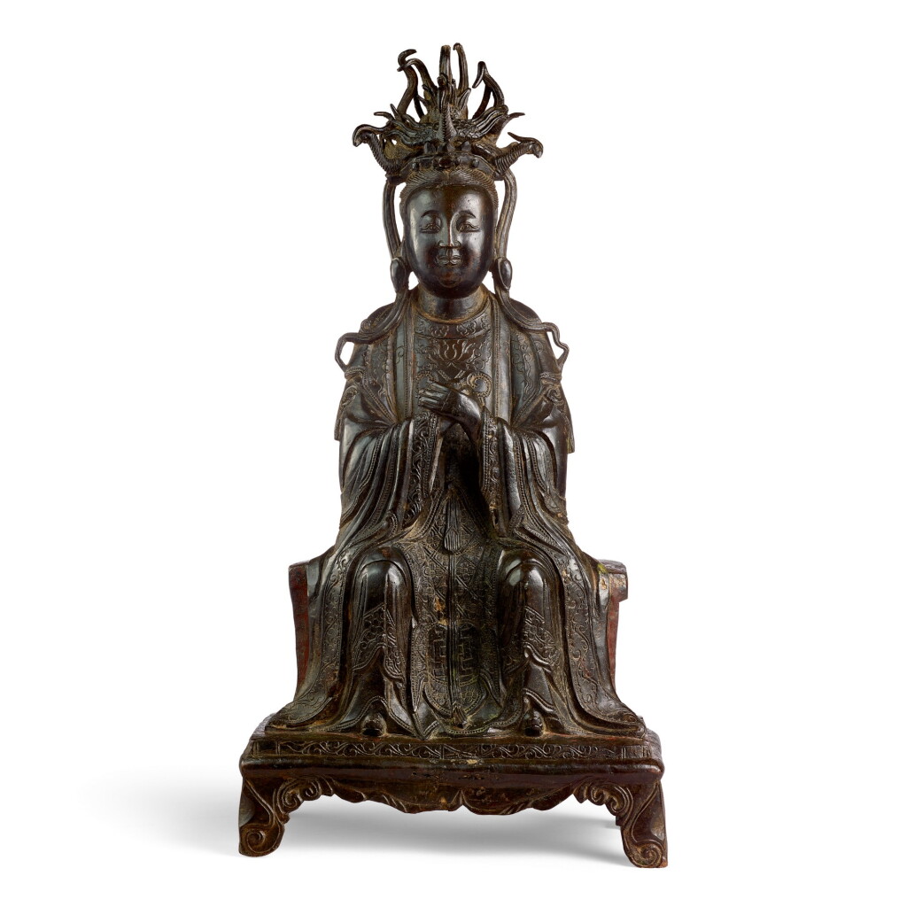 View full screen - View 1 of Lot 3655. AN EXTREMELY RARE LARGE BRONZE FIGURE OF XIWANGMU MING DYNASTY, LONGQING PERIOD, DATED 1571 | 明隆慶 銅西王母像 《隆慶五年四月十八日造》銘.