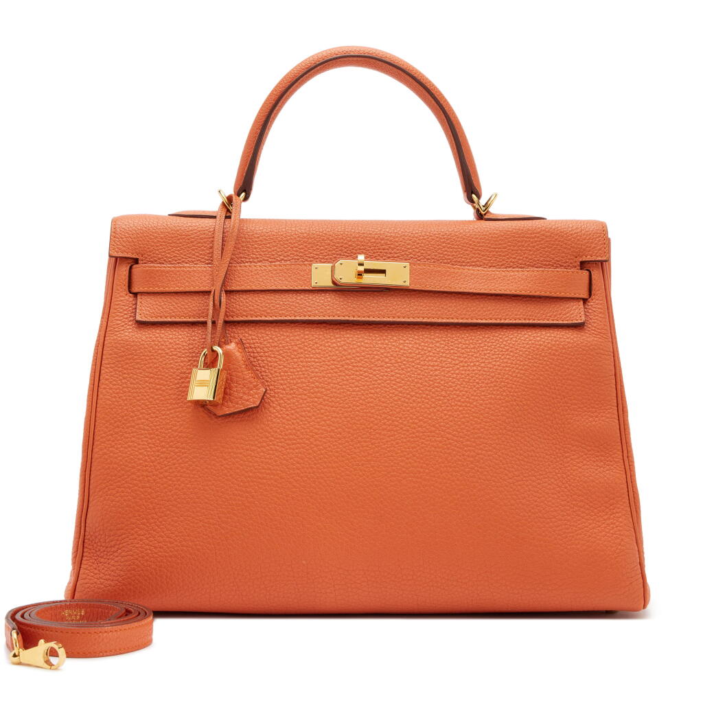 View full screen - View 1 of Lot 110. Orange H Clemence Retourne Kelly 35 Gold Hardware, 2013.