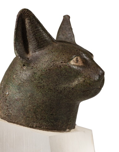 View full screen - View 1 of Lot 35. An Egyptian bronze head of a cat, 26th/30th dynasty, 664-342 B.C. | Tête de chat en bronze, art égyptien, XXVIe / XXXe dynastie, 664-342 avant J.-C..