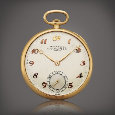 View full screen - View 1 of Lot 51. Retailed by Tiffany & Co.: A yellow gold open faced watch, Circa 1940.