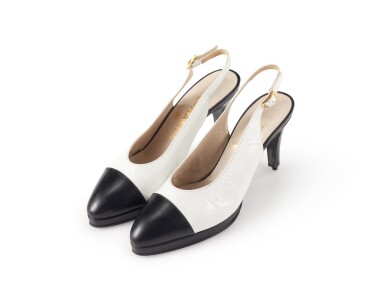 View full screen - View 1 of Lot 6. CHANEL | PAIR OF WHITE AND BLACK LEATHER SLINGBACK SANDALS .