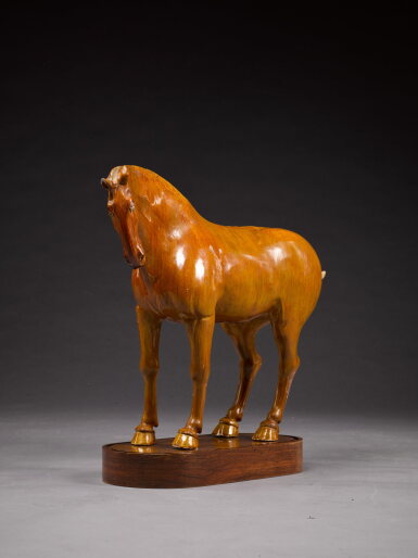 View full screen - View 1 of Lot 280. A large amber-glazed pottery model of a horse, Tang Dynasty.