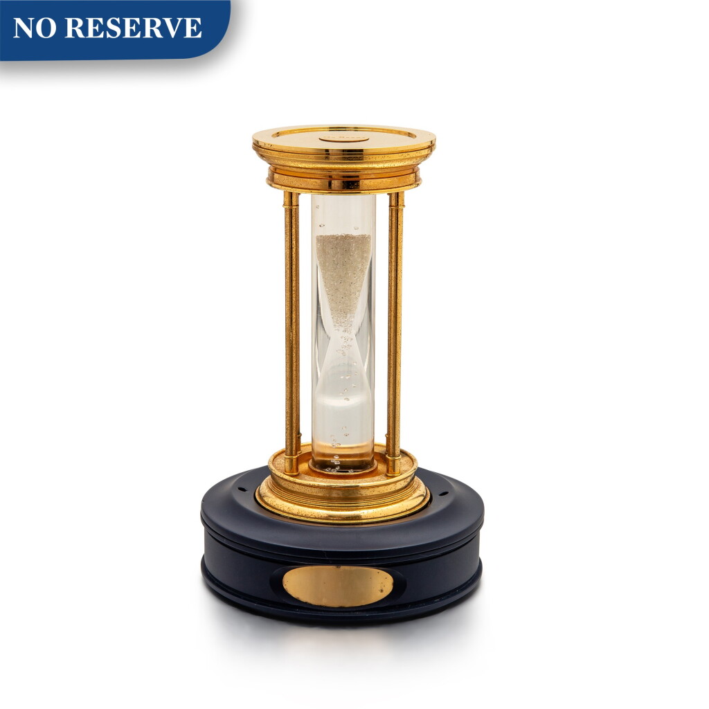 View full screen - View 1 of Lot 8001. De Beers | A gilt brass hourglass with floating diamonds, Circa 2000 | 鍍金銅製沙漏,備浮動鑽石,約2000年製.