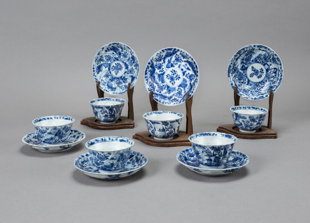 View full screen - View 1 of Lot 65. A group of six blue and white 'flower and landscape' barbed-rim cups and saucers, Qing dynasty, Kangxi period | 清康熙 青花山水花卉紋菱口盃及小盤一組十二件.