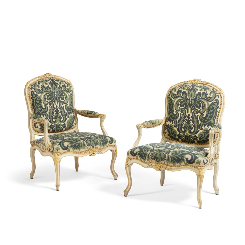 View full screen - View 1 of Lot 619. A pair of Louis XV white- and cream-painted armchairs à la reine, stamped N. Q. Foliot, circa 1750.