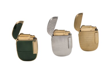 View full screen - View 1 of Lot 21. PATEK PHILIPPE | SET OF THREE GOLD AND ENAMEL LIGHTERS CIRCA 1980.
