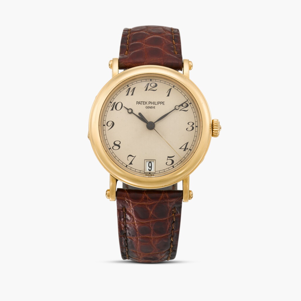 View full screen - View 1 of Lot 18. Calatrava, Reference 5053J-001 | A yellow gold wristwatch with date | Circa 2005.