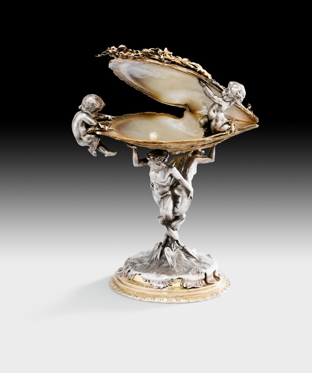 View full screen - View 1 of Lot 268. A silver, silver-gilt and pearl oyster cup, by Emile Froment-Meurice, circa 1880 | Coquille d'huître perlière montée en coupe, argent, vermeil et perle, par Emile Froment-Meurice, vers 1880.