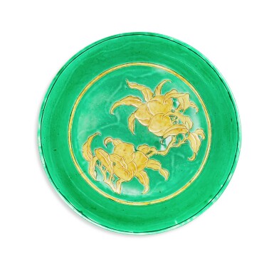 View full screen - View 1 of Lot 3349. A rare green-ground and yellow biscuit-enamelled 'peach' dish, Ming dynasty, 16th century | 明十六世紀 綠地黃彩刻桃紋盤.