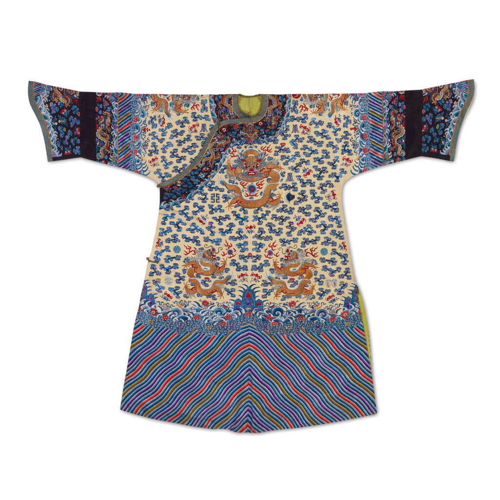 View full screen - View 1 of Lot 915. AN IMPERIAL PALE YELLOW-GROUND EMBROIDERED SILK TWELVE-SYMBOL ‘DRAGON’ ROBE, LATE QING DYNASTY.