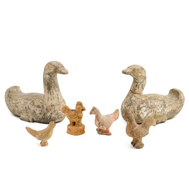 A group of six pottery figures of birds