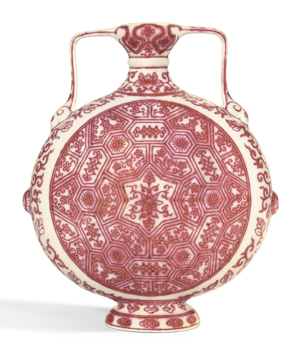 View full screen - View 1 of Lot 156. A RARE MING-STYLE COPPER-RED DECORATED MOONFLASK QIANLONG SEAL MARK AND PERIOD | 清乾隆 釉裏紅蓮花錦紋如意耳抱月瓶 《大清乾隆年製》款.