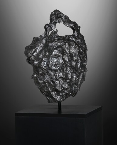 View full screen - View 1 of Lot 102. Seymchan Meteorite | Massive Meteorite With Naturally Formed Hole.
