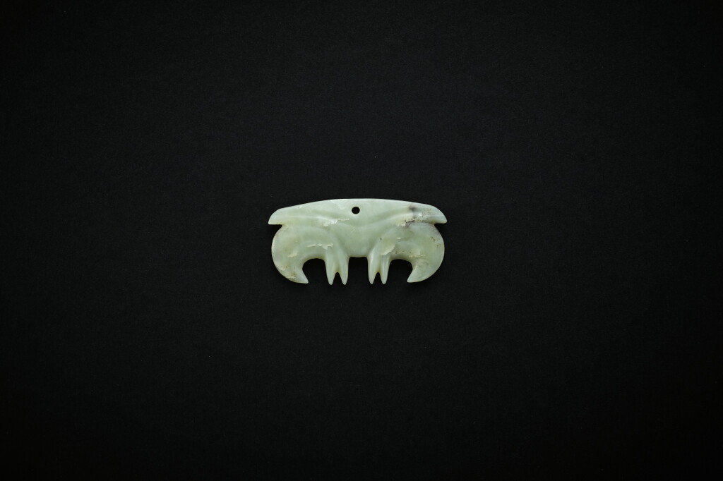View full screen - View 1 of Lot 3773. A pale celadon jade 'cloud' pendant, Neolithic period, Hongshan culture | 新石器時代 紅山文化 青白玉雲形珮.