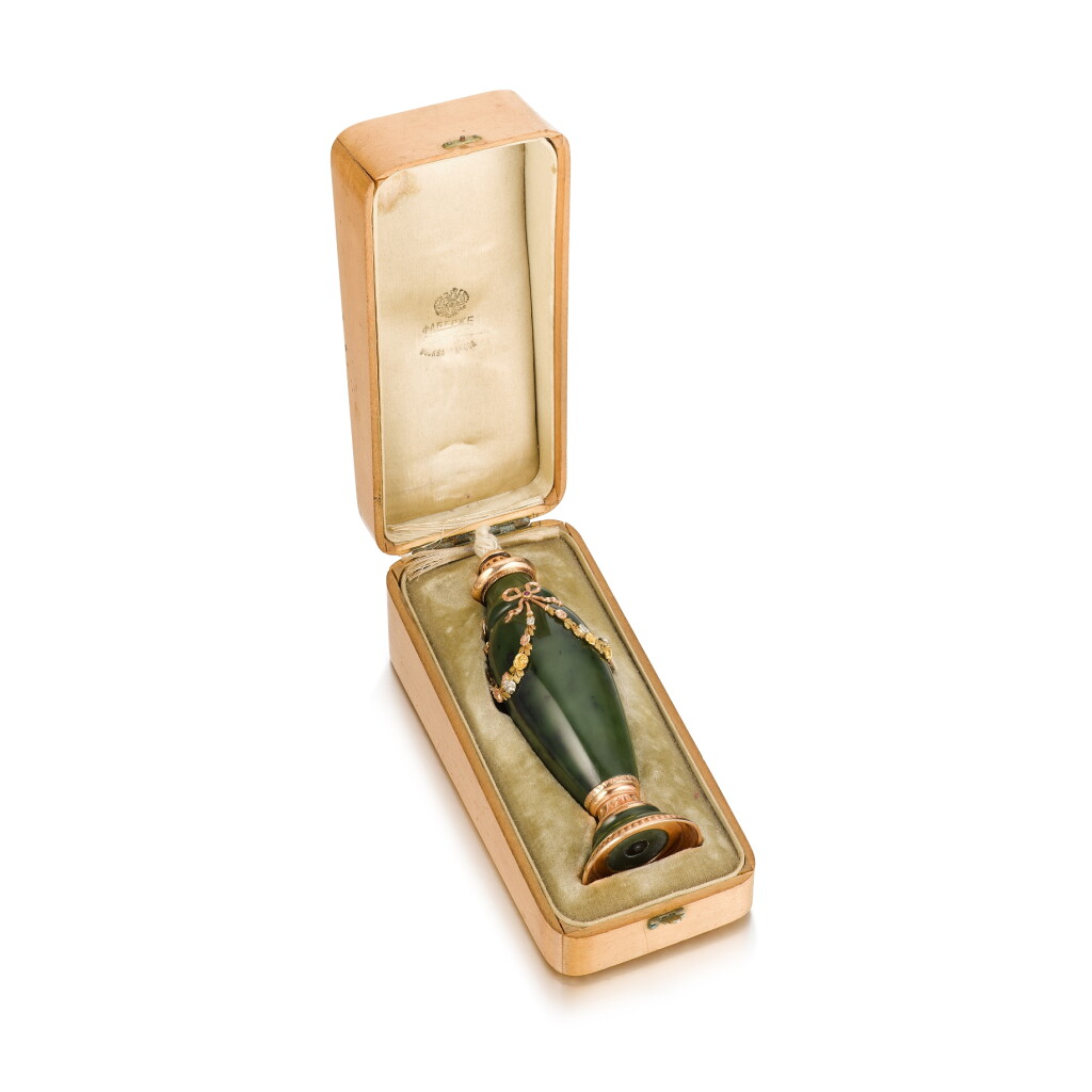 View full screen - View 1 of Lot 1020. A Fabergé varicoloured gold-mounted nephrite table lighter, workmaster Henrik Wigström, St Petersburg, 1903- 1908.