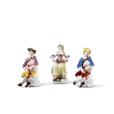 View full screen - View 1 of Lot 378. Two Meissen porcelain Commedia dell'Arte figures of Harlequin playing the bagpipes and a Meissen porcelain figure of a lady playing the hurdy-gurdy, circa 1745-50.