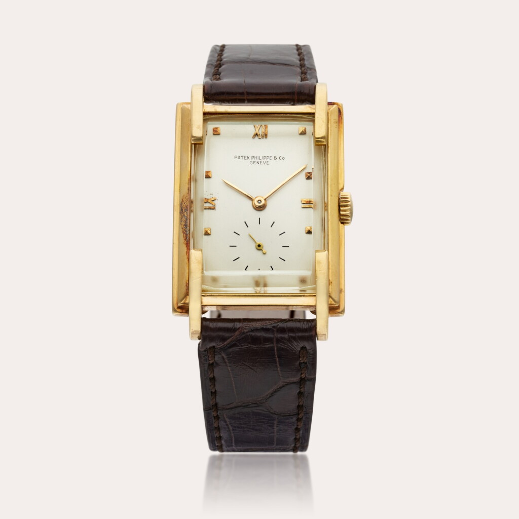 View full screen - View 1 of Lot 320. Reference 1511 | A yellow gold rectangular wristwatch, Made in 1942.
