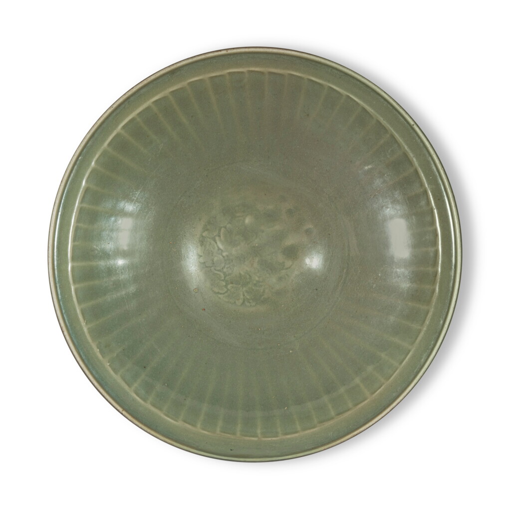 View full screen - View 1 of Lot 944. A large molded 'Longquan' celadon-glazed dish, Ming dynasty | 明 龍泉窰青釉印花大盤.