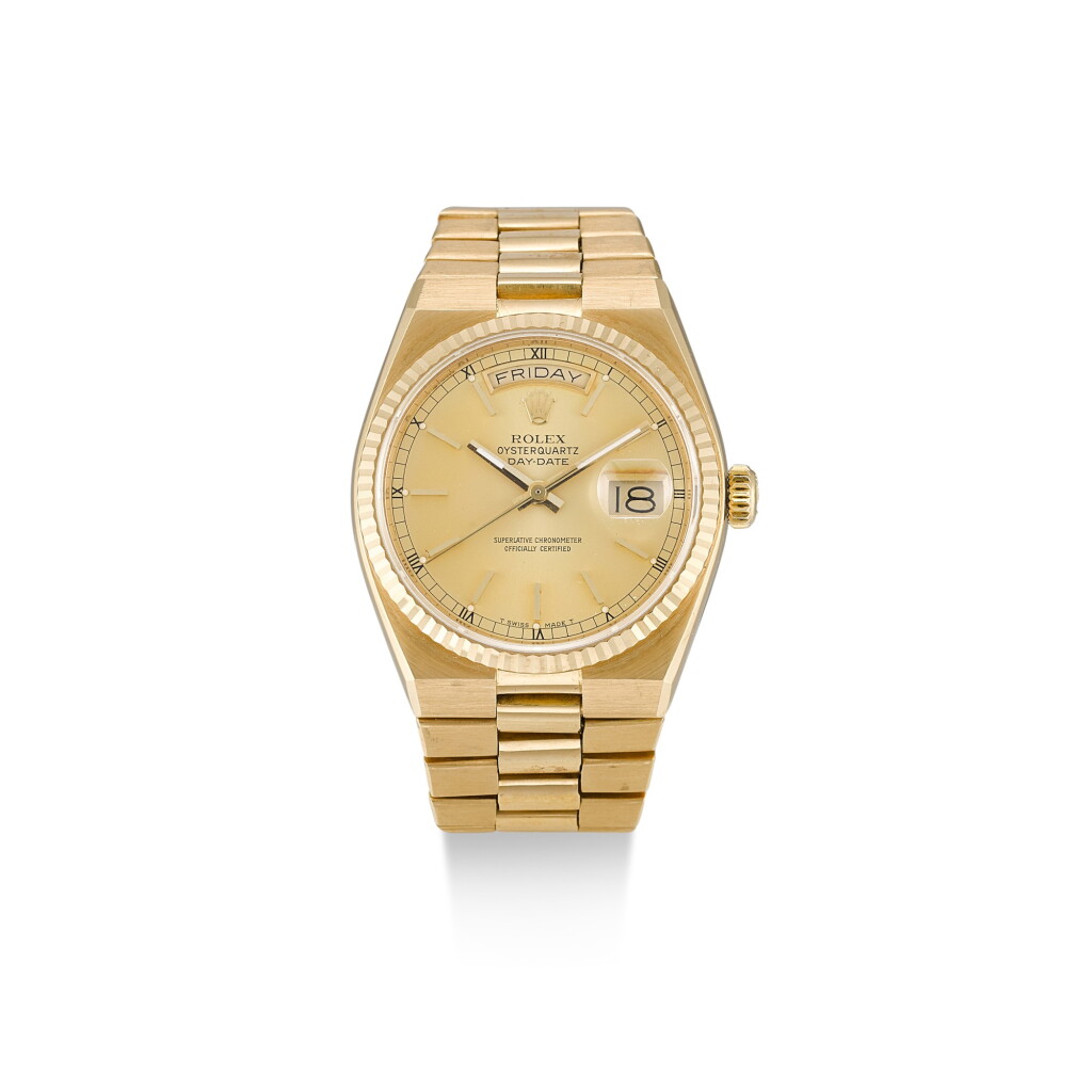 View full screen - View 1 of Lot 8132. ROLEX | OYSTERQUARTZ DAY-DATE, REFERENCE 19018 A YELLOW GOLD BRACELET WATCH WITH DAY AND DATE, CIRCA 1986.
