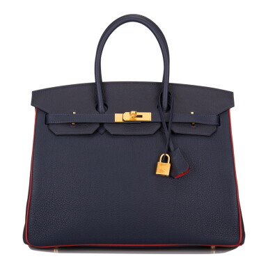 View full screen - View 1 of Lot 61. Hermès Horseshoe Stamp (HSS) Bicolor Bleu Nuit and Vermillion Birkin 35cm of Togo Leather with Gold Hardware.