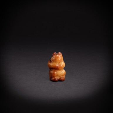 View full screen - View 1 of Lot 5661. A white and russet jade 'bear' pendant, Liao dynasty or earlier | 遼或更早 白玉熊墜.