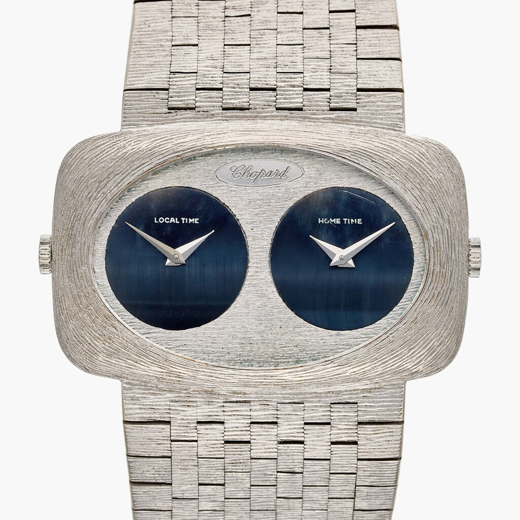 View full screen - View 1 of Lot 662. Reference 2051-1 | A white gold dual time zone bracelet watch with hawk-eye dials, Circa 1970.