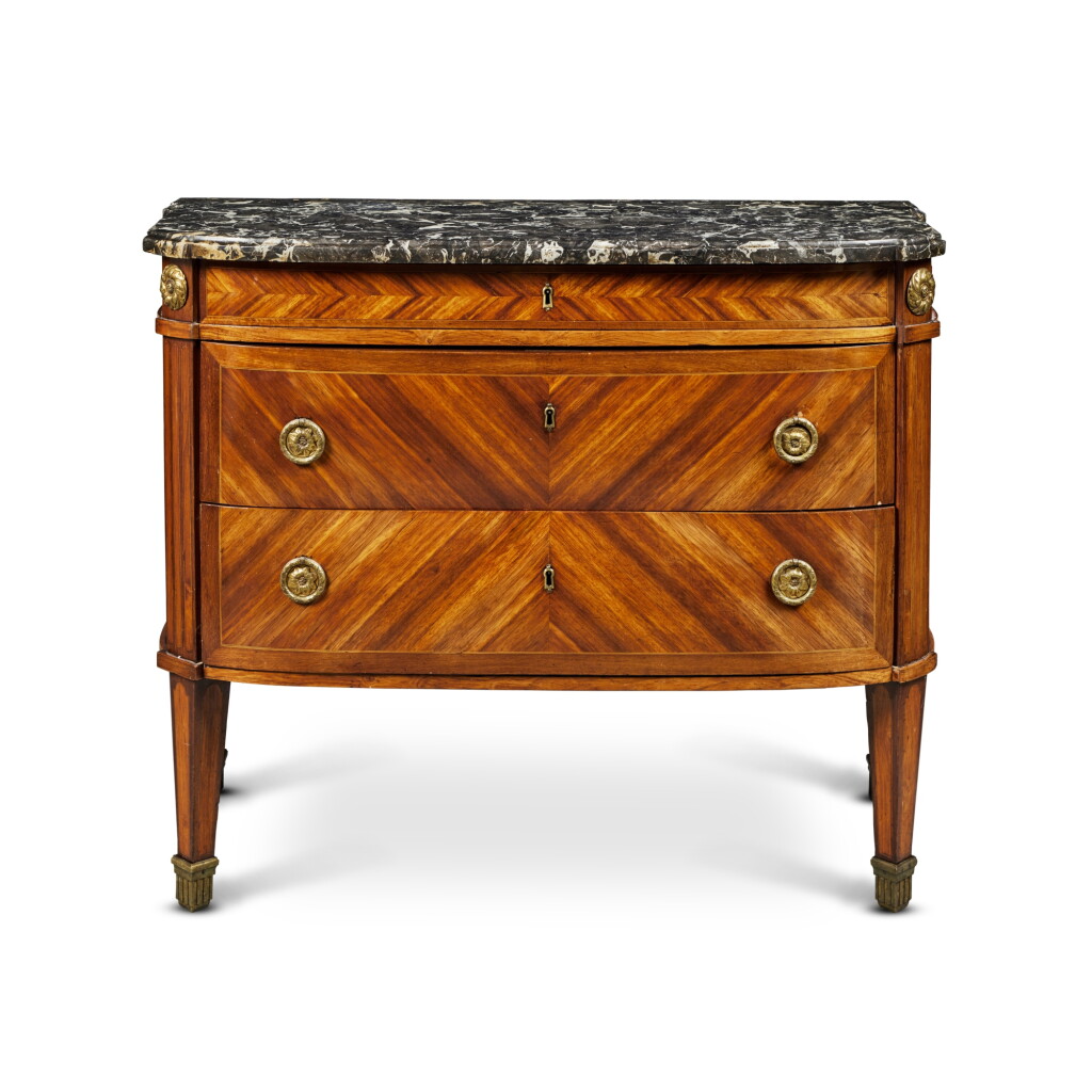 View full screen - View 1 of Lot 64. A Louis XVI Gilt-Bronze Mounted Amaranth and Bois Satiné Commode, Stamped J.F. Leleu JME, Circa 1780.