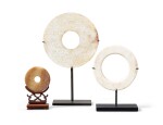A group of three archaistic jade discs Qing dynasty | 清 仿古玉環及璧一組三件