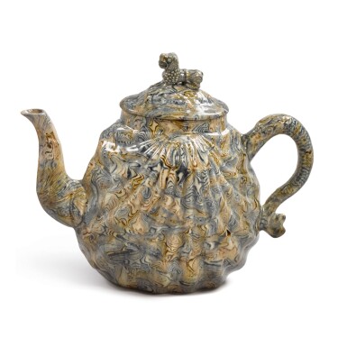 View full screen - View 1 of Lot 1630. A STAFFORDSHIRE SOLID-AGATE PECTEN-SHELL TEAPOT AND COVER, CIRCA 1750.