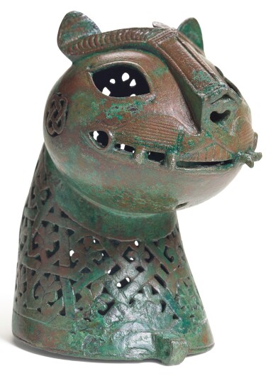 View full screen - View 1 of Lot 442. A FINE CAST BRONZE FELINE HEAD FROM AN INCENSE BURNER, KHURASAN OR AFGHANISTAN, 11TH-12TH CENTURY.