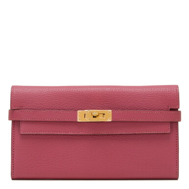 View full screen - View 1 of Lot 167. Hermès Bois de Rose Kelly Long Wallet of Chevre Leather with Gold Hardware.
